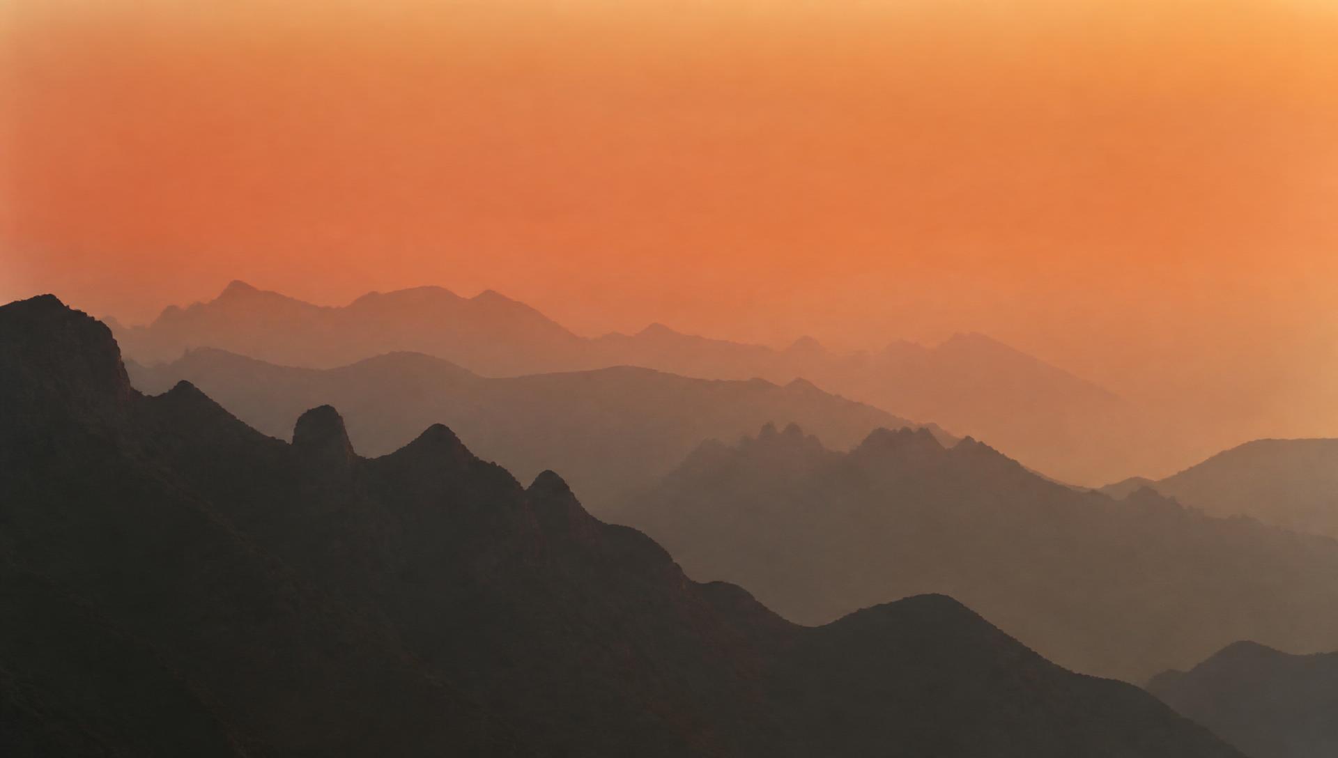 Layered mountain ridges at dusk